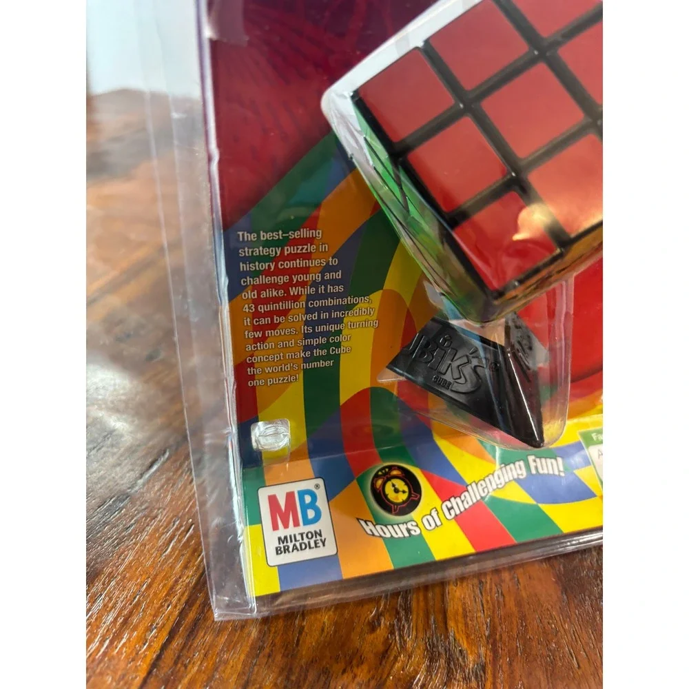 Milton Bradley Rubiks Cube 3x3 Puzzle with Stand and Booklet 54033 New Sealed